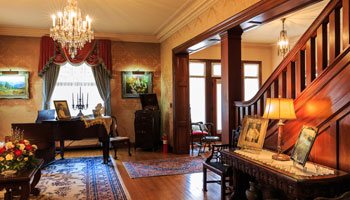 The sitting room and staircase at the Frank Phillips Home