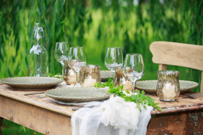 A simple yet elegant table setting at an outdoor reception on the Frank Phillips Mansion Lawn